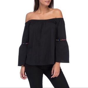 Bobeau black off the shoulder top with colorful pom poms